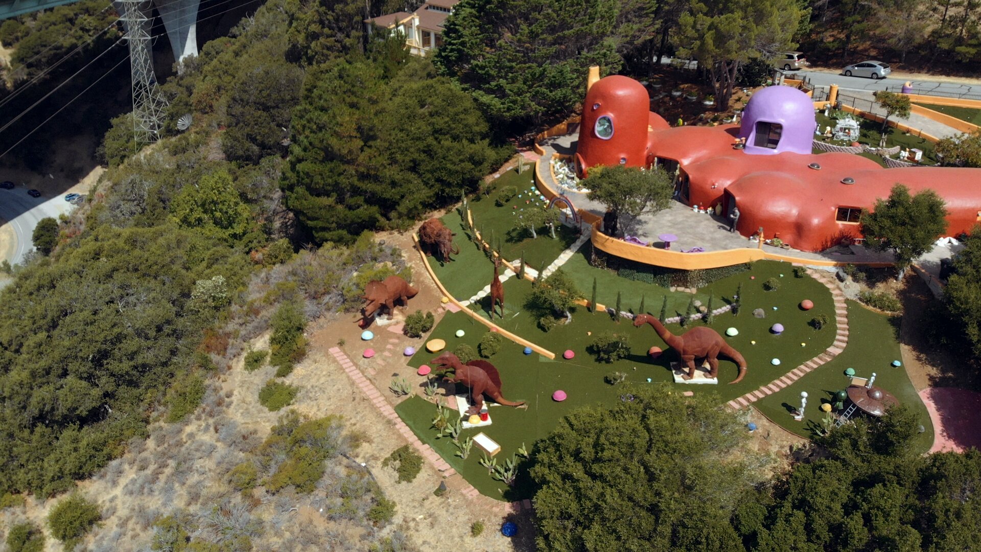 Alternate aerial view of Flintstone House dinosaur sculptures - California landmark